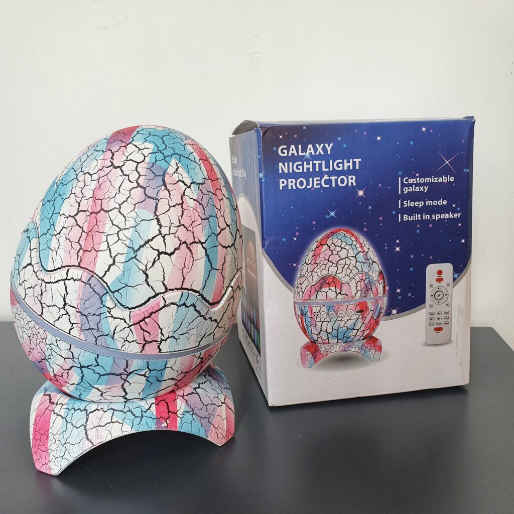 Galaxy Nightlight projector in the shape of an egg. Built in speaker. Projects the galaxy and stars onto a wall or ceiling with the option of music or sounds. Promotes calming and relaxation.